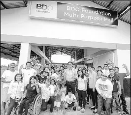  ??  ?? PWDs and their benefactor­s enjoy working together at the BDOF multi-purpose hall.