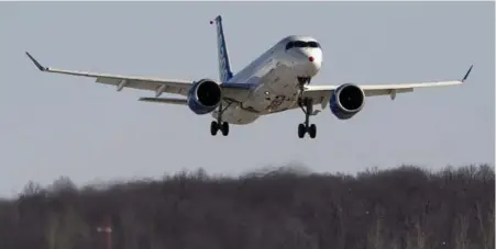  ?? RYAN REMIORZ/THE CANADIAN PRESS ?? A Bombardier CS300 on its maiden flight in Mirabel, Que., on Feb. 27. Test flights are continuing, with the fuel-efficient jet going on sale in 2016.