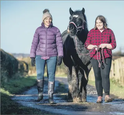  ?? PICTURE: JAMES HARDISTY. ?? Martha Holmes, 18, with mum Jane Dixon, of Leeds, holding one of the Autism Angels horses, Riley. FRESH START: