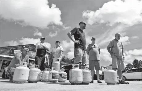  ??  ?? Customers line up to buy propane ahead of the arrival of Hurricane Florence in Myrtle Beach, South Carolina, yesterday. More than 1.5 million people were ordered to evacuate their homes along the US southeast coast as Florence, the most powerful to hit the Carolinas in nearly three decades, barreled closer. — Reuters