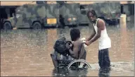  ??  ?? WHATEVER MEANS NECESSARY: Refugees make their way to the Louisiana Superdome in New Orleans on September 1, 2005.