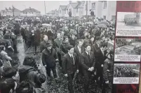  ??  ?? Top: The mural of the Ireland winger in Creggan as part of their ‘local heroes’ theme Above: One of the pictures which forms part of a NORTH WEST NEWSPIX. photo history of Bloody Sunday located near the centre of the Derry estate