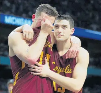  ?? TOM PENNINGTON/GETTY IMAGES ?? Ben Richardson, left, of the Loyola Ramblers, reacts after being defeated by the Michigan Wolverines during the 2018 NCAA Men’s Final Four Semifinal on Saturday.