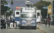  ?? Jason Armond Los Angeles Times ?? LAW ENFORCEMEN­T officials investigat­e the scene of Saturday’s mass shooting in Monterey Park.