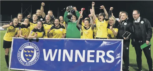  ?? PICTURE BY SHEENA BOOKER ?? Chichester City Ladies show their joy – and show off the Sussex Cup – after beating Brighton’s developmen­t team 1-0 at Culver Road