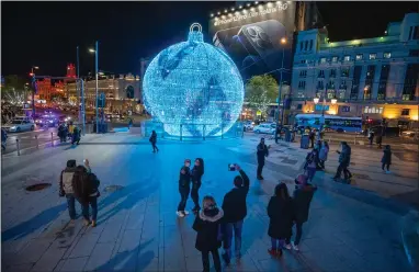  ??  ?? This giant bauble is among the lights installed for the festive season in Madrid. The city budget for Christmas lights is £2.8m