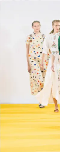  ??  ?? Wickstead’s collection, inspired by 1970s ‘love hotels’, featured high necks, ballon sleeves, sheering details and sprig-printed cotton, with sandals by Charlotte Olympia for the butter-wouldn’t-melt look