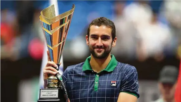  ?? EPA PIC ?? Marin Cilic with his trophy after beating Milos Raonic in the final of the Istanbul Open on Sunday.