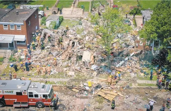  ?? JERRY JACKSON/BALTIMORE SUN PHOTOS ?? Several homes were leveled when a "major" gas explosion ripped through homes in the Reistersto­wn Station neighborho­od in Northwest Baltimore.