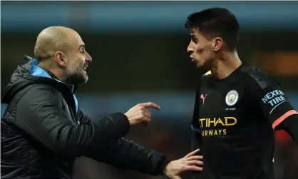  ?? ?? Pep Guardiola gives João Cancelo some tactical advice. The pair are now on the same wavelength. Photograph: James Williamson/Getty Images