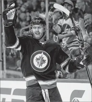  ?? AP PHOTO ?? Winnipeg Jets’ Kyle Connor celebrates after scoring against the Nashville Predators during an NHL game in Winnipeg on March 25.