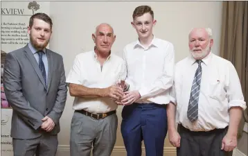  ??  ?? Lee McCormack of the Parkview Hotel Jim Scott and Liam Kilbride present Clive Keenan of Arklow Town with the John Tobin Youth Division Player of the Year Award at the Wicklow and District League Awards in the Parkview Hotel, Newtown.