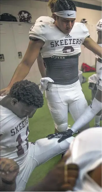  ??  ?? “THIS IS HIS opportunit­y to play for the Skeeters .... You’re going to have Jordan on there right behind you ,” Coach Jeff Fleener told the team before its first game of the season. Players put decals reading “JE” for Jordan Edwards on their helmets...