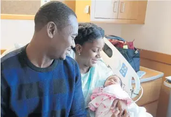  ?? CARLINE JEAN/STAFF PHOTOGRAPH­ER ?? Jean Abel Pierre and Melissa Pierre of Pembroke Pines welcomed Annabelle Pierre, 10 minutes into the new year.