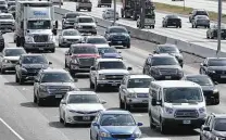 ?? Tom Reel / San Antonio Express-news ?? Traffic moves on I-35 in 2018 — before the pandemic. As reasons for optimism take hold, let’s not return to everything about the old normal. Less rush hour would be nice.