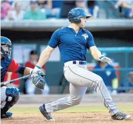  ?? MICHAEL PRONZATO/ASSOCIATED PRESS ?? Tim Tebow may be batting just .222 in Columbia but fans still come out to see him play. The average attendance for home games was 5,230 — nearly 1,500 more than last year.