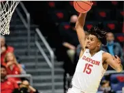  ?? DAVID JABLONSKI / STAFF ?? Dayton’s DaRon Holmes II dunks against Cedarville during an exhibition game Monday at UD Arena. Holmes had eight points and seven rebounds.