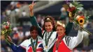  ??  ?? Ghada Shouaa (center) made history when she won gold at Atlanta in 1996