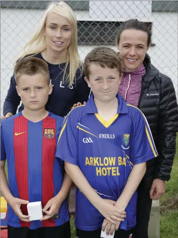  ??  ?? County players Martin Kelly and Darragh Heffernan with Stephanie Roche and Áine O’Gorman at the recent Newtown Juniors FC awards event and mini world cup.