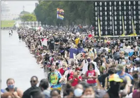  ?? JULIO CORTEZ — THE ASSOCIATED PRESS ?? Thousands join the March on Washington on Friday in Washington on the 57th anniversar­y of the Rev. Martin Luther King Jr.’s “I Have a Dream” speech.