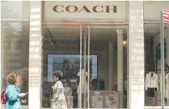  ?? SPENCER PLATT / GETTY IMAGES ?? Coach, the U. S. luxury-goods maker, said Monday it would buy rival Kate Spade in a US$2.4 billion deal.