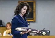  ?? STEPHEN SPILLMAN / FOR AMERICAN-STATESMAN ?? Prosecutor Katie Sweeten reminds the jury of a stolen shotgun in Friday’s closing arguments in Timothy Parlin’s capital murder trial.