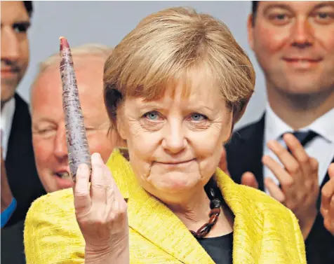  ??  ?? Angela Merkel, the leader of the Christian Democratic Union Party (CDU), holds a carrot during a campaign rally in Freiburg, but she may be more likely to wield a stick in Brexit talks