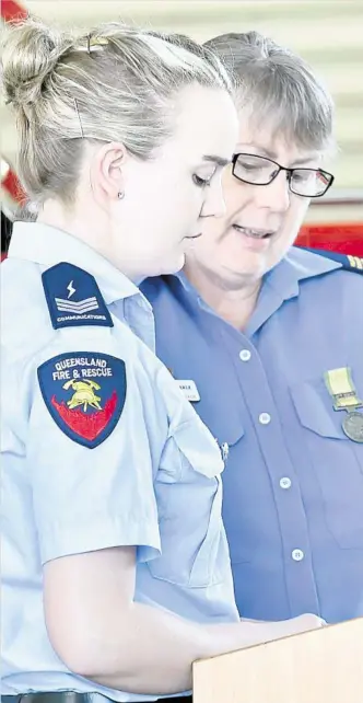  ?? PHOTOS: BEV LACEY ?? HONOUR ROLL : Katie Connolly (left) and Vicki Searle read the names of 50 firefighte­rs who have died in the line of duty since 1877 as part of National Firefighte­rs Remembranc­e Day.