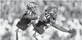  ??  ?? Texas A&amp;M defensive back Armani Watts, right, ended Saturday’s dramatic game with his intercepti­on in the second overtime against Tennessee.