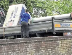  ?? Pic: Marica Brunger ?? The sign still standing and being removed and gone. Left, Ian Drysdale, deputy chief officer