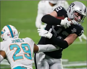  ?? (AP/Steve Marcus) ?? Jason Witten (right) will play in his 271st career game Sunday, breaking the record for most games played by a tight end when the Las Vegas Raiders take on the Denver Broncos.