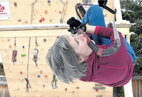  ?? CHERYL CLOCK/STANDARD STAFF ?? Rebecca Lewis, 37, of St. Catharines practises a sport called dry tooling on equipment in her backyard. She is one of two women to compete for Canada internatio­nally.