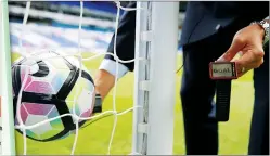  ?? PIC: Action Images ?? IT WORKS! Ref Andre Marriner tests the system