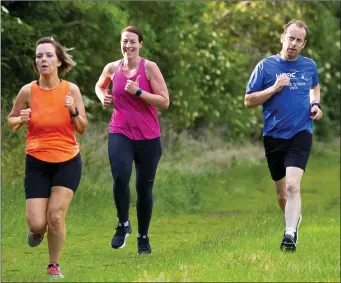  ??  ?? A group of United Striders athletes availing of the easing of Covid-19 restrictio­ns on their return to training at the C.B.S. Park in New Ross.