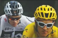  ?? The Associated Press ?? YELLOW SKY: Geraint Thomas, wearing the overall leader’s yellow jersey in front, and Chris Froome ride Saturday during the 14th stage of the Tour de France over 116.8 miles from Saint-Paul Trois-Chateaux to Mende, France.