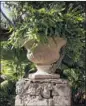  ??  ?? A plant and a stone column create a rustic focal point in a corner of the garden.