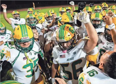  ?? ?? Coachella Valley players get a huddle and a break after their win at Palo Verde High School in Blythe on Aug. 25.