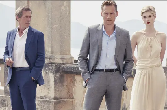  ?? The Night Manager. ?? ARMS AND THE MAN: Hugh Laurie, Tom Hiddleston and Elizabeth Debick in