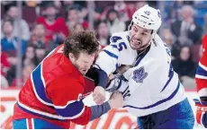  ?? RICHARD WOLOWIC Z/GET TY IMAGES, FILE ?? New Oilers tough guy Mark Fraser, right, roughs up Brandon Prust of the Montreal Canadiens during a game last February.