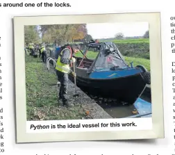  ?? ?? A work party tackles jobs around one of the locks.
Python is the ideal vessel for this work.