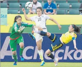  ?? Jason Franson
Associated Press ?? “OUR BEST is yet to come,” says Carli Lloyd ( 10), shown during U. S.’ victory Monday over Colombia. Lloyd has scored a goal in the current tournament.