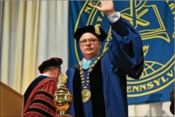  ?? SUBMITTED PHOTO ?? New Neumann University President Dr. Chris Domes waves to the crowd of 1,000 moments after receiving the presidenti­al medallion on Friday.