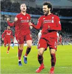  ?? Picture: PAUL CHILDS/REUTERS ?? NICE ONE!: Liverpool’s Mohamed Salah, right, celebrates scoring their first goal with teammate Jordan Henderson in their English Premier League soccer clash against Brighton on Saturday