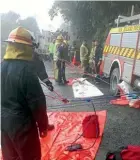  ??  ?? Firefighte­rs worked in treacherou­s conditions to rescue the trapped woman yesterday.