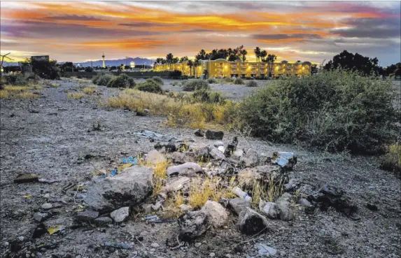  ?? L.E. Baskow Las Vegas Review-Journal @Left_Eye_Images ?? Aaron Jones, 13, died sometime in the winter of 2017 and his body was found under rocks behind Siegel Suites off of Boulder Highway. This fire pit filled with debris, seen June 27, is thought to be near that very spot.