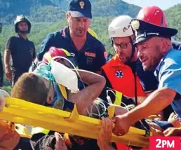  ??  ?? Lastly, rescuers carry Ciro, 11, to safety on a plastic stretcher 2PM