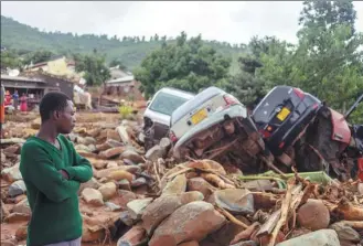  ?? ZINYANGE AUNTONY / AFP ?? Debris lies strewn over Chimaniman­i, Zimbabwe, on Monday after the area was hit by deadly cyclone Idai.