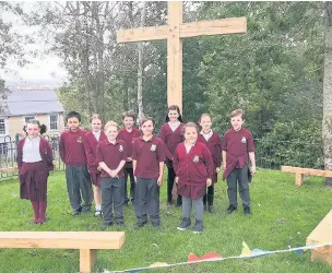  ??  ?? Members of the school Senedd at St Mary’s Catholic Primary School in Bridgend came up with the idea of creating a prayer garden to mark the school’s golden anniversar­y at its Cefn Glas site