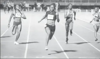  ??  ?? Jasmine Abrams (11.37s) wins the female 100m final. (Emmerson Campbell photo)