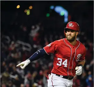  ?? File photo ?? MLB veterans are getting frustrated with free agency because salaries are going down. Free agent outfielder Bryce Harper (34) is still unsigned with spring training going on.